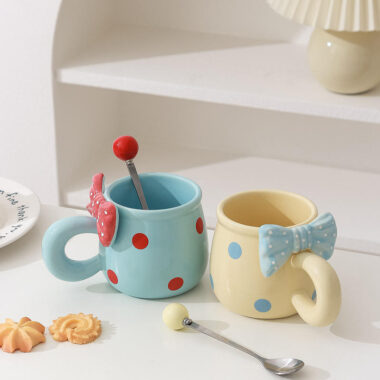 3D bow tie ceramic mugs in pastel colors on white background