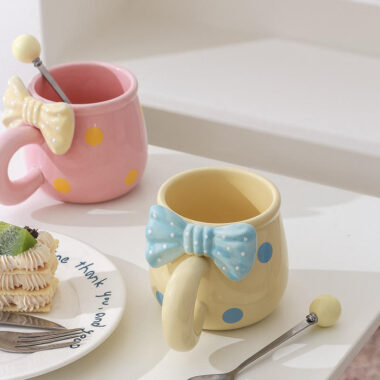 3D bow tie ceramic mugs in pastel colors on white background
