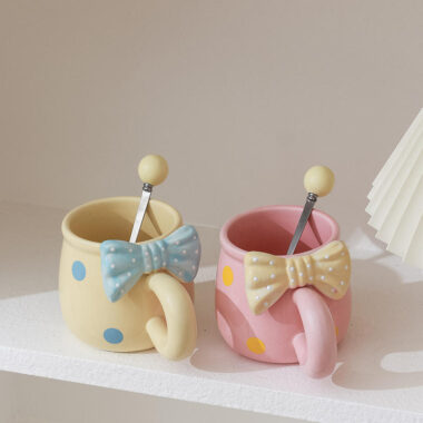 3D bow tie ceramic mugs in pastel colors on white background