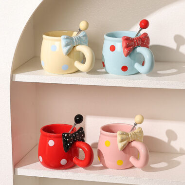 3D bow tie ceramic mugs in pastel colors on white background
