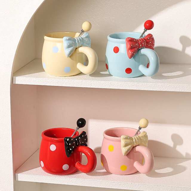 3D bow tie ceramic mugs in pastel colors on white background