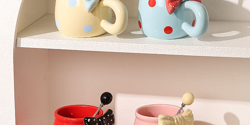 3D bow tie ceramic mugs in pastel colors on white background