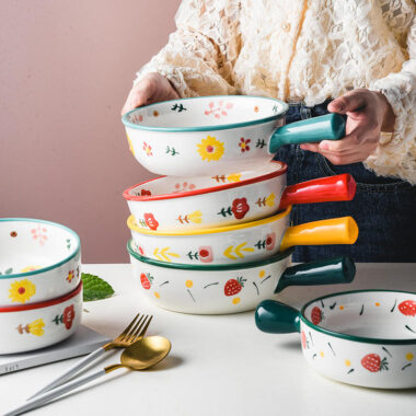 Cute ceramic bowl with colorful handle and printed pattern