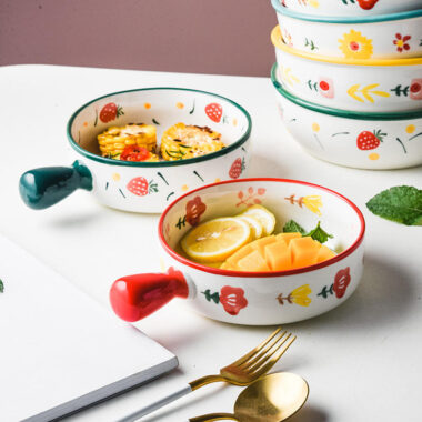 Cute ceramic bowl with colorful handle and printed pattern