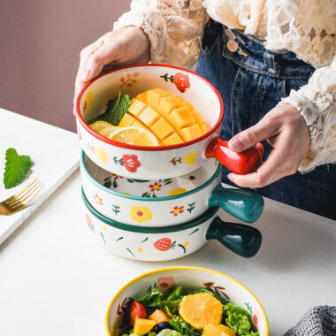 Cute ceramic bowl with colorful handle and printed pattern
