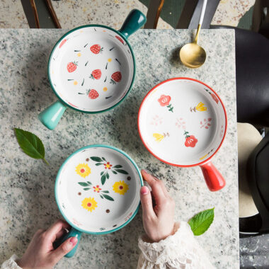 Cute ceramic bowl with colorful handle and printed pattern