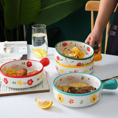 Cute ceramic bowl with colorful handle and printed pattern