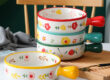 Cute ceramic bowl with colorful handle and printed pattern