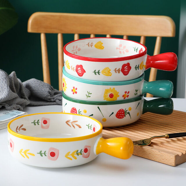 Cute ceramic bowl with colorful handle and printed pattern