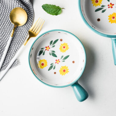 Cute ceramic bowl with colorful handle and printed pattern