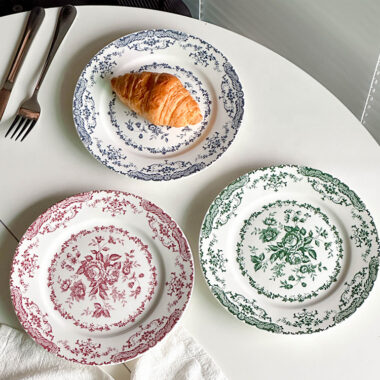Vintage round crockery plates with floral design