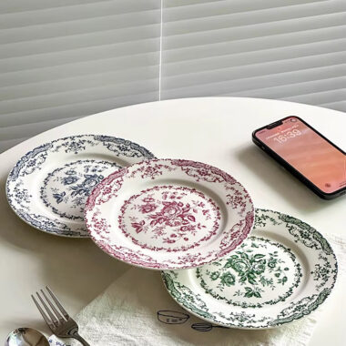 Vintage round crockery plates with floral design